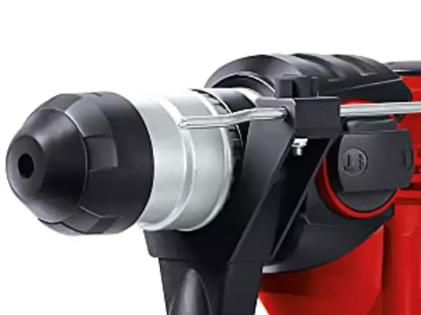 Pohled na pneumatický příklepový mechanismus Einhell vrtacího kladiva TC-RH 900 s kovovým krytem.